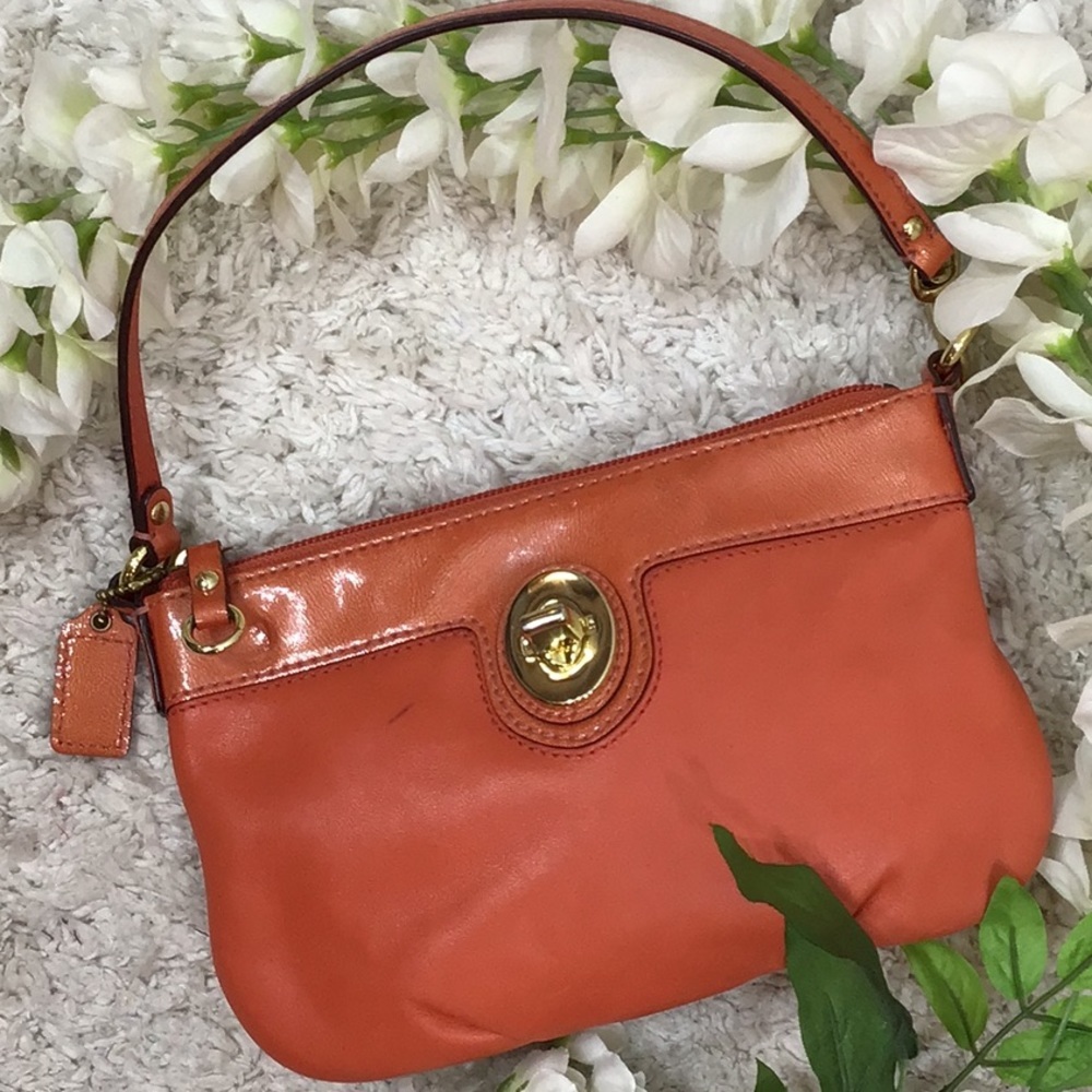 Coach orange convertible leather wristlet